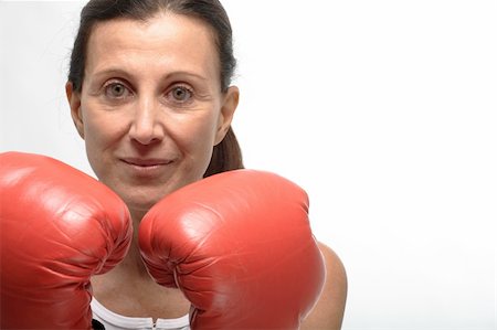 Mature woman wearin boxing gloves on guard Stock Photo - Budget Royalty-Free & Subscription, Code: 400-05104469