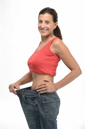 fitness   mature woman - Happy mature woman in old jeans pant after losing weight Stock Photo - Budget Royalty-Free & Subscription, Code: 400-05104462
