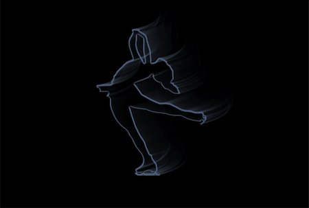 Silhouette of an ice skater over black background Stock Photo - Budget Royalty-Free & Subscription, Code: 400-05105022