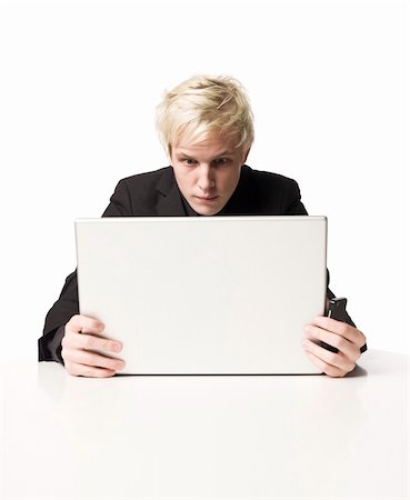 sorry boy pictures - Man reading on a computer Stock Photo - Budget Royalty-Free & Subscription, Code: 400-05105287