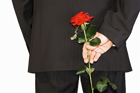 surprise people - man in black suite hiding back red rose Photographie de stock - Aubaine LD & Abonnement, Code: 400-05106795