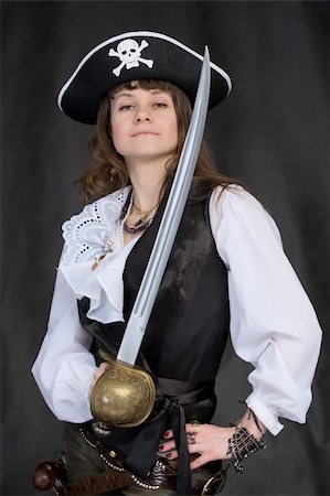 rapier - The girl - pirate with a sabre in hands on a black background Photographie de stock - Aubaine LD & Abonnement, Code: 400-05106922