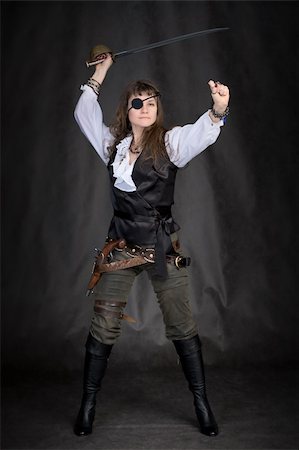 The girl - pirate with a sabre in hands and eye patch on face Stock Photo - Budget Royalty-Free & Subscription, Code: 400-05106923