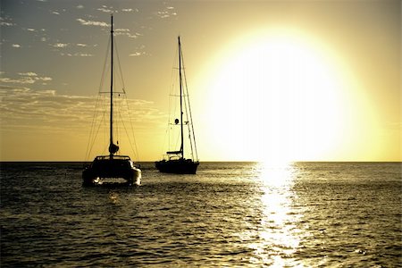 Boats at sunset in Guadeloupe Foto de stock - Super Valor sin royalties y Suscripción, Código: 400-05107363