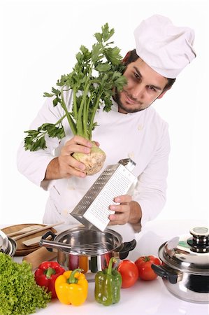 simsearch:689-03128584,k - young chef preparing lunch on white background Stockbilder - Microstock & Abonnement, Bildnummer: 400-05107563
