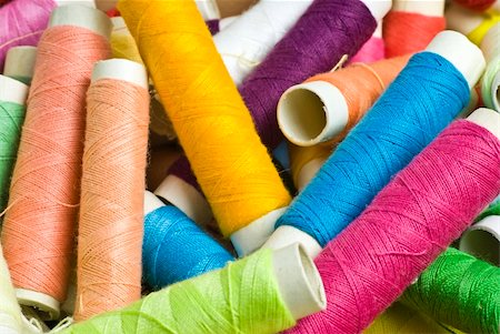 random background or texture of sewing threads, wound on bobbins or spools Stock Photo - Budget Royalty-Free & Subscription, Code: 400-05107935