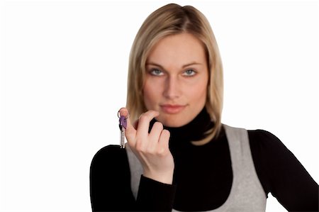 Serious Businesswoman holding Keys2 Stock Photo - Budget Royalty-Free & Subscription, Code: 400-05108218