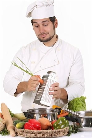 simsearch:689-03128584,k - young chef preparing lunch and cutting carrot with stainless grater Stockbilder - Microstock & Abonnement, Bildnummer: 400-05108407