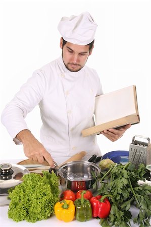 simsearch:400-04116514,k - young chef preparing lunch on white background Stockbilder - Microstock & Abonnement, Bildnummer: 400-05108423