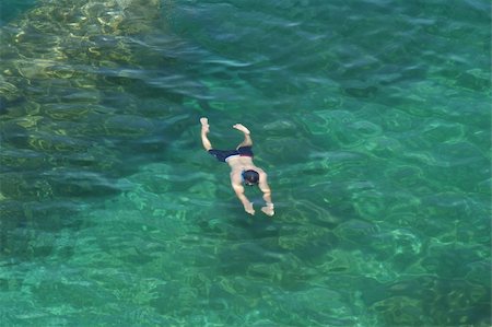 A man swimming under water in the cool waters of Georgian Bay, Ontario, Canada. Stockbilder - Microstock & Abonnement, Bildnummer: 400-05109209