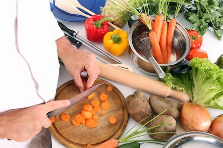 simsearch:689-03128584,k - chef preparing lunch and cutting carrot with knife Stockbilder - Microstock & Abonnement, Bildnummer: 400-05109223