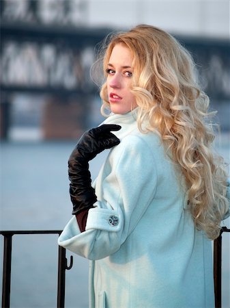 Beautiful blonde lady in overcoat on promenade Stock Photo - Budget Royalty-Free & Subscription, Code: 400-05109841