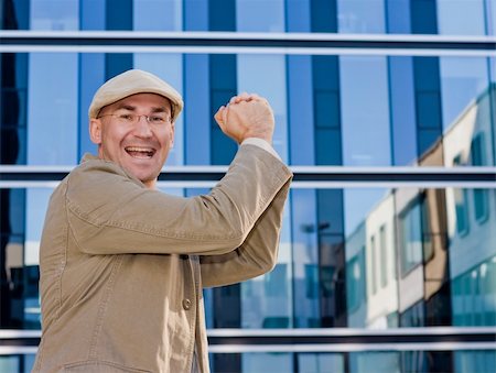 dpix (artist) - business man smiling, hands building a victorious  fist Photographie de stock - Aubaine LD & Abonnement, Code: 400-05101213