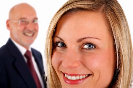 dpix (artist) - young successful smiling female with senior businessman in background (on white) Photographie de stock - Aubaine LD & Abonnement, Code: 400-05101235