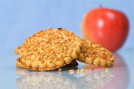 peanut cookie - Peanut chips cookies and a red apple on reflective surface - closeup Stock Photo - Budget Royalty-Free & Subscription, Code: 400-05101885