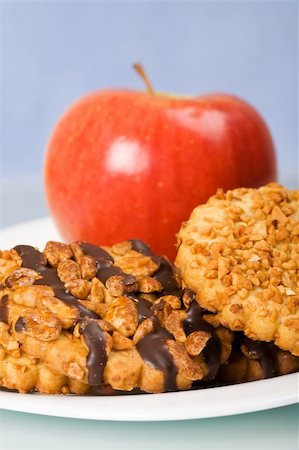 peanut cookie - Peanut and chocolate cookies with apple on white plate - closeup Stock Photo - Budget Royalty-Free & Subscription, Code: 400-05101889