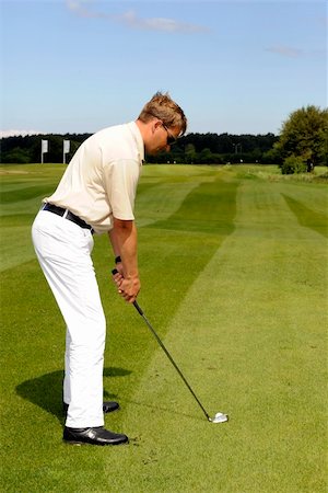 A golf player strikes a shot Stock Photo - Budget Royalty-Free & Subscription, Code: 400-05102490