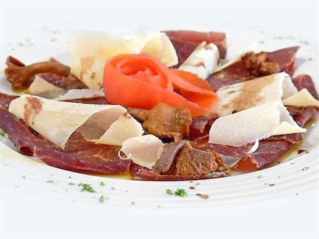 Beef carpaccio on a white plate Stock Photo - Budget Royalty-Free & Subscription, Code: 400-05102547