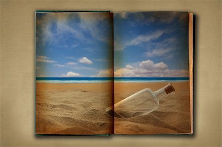 simsearch:400-05174298,k - Distressed Vintage Stained Old Book With Ocean Photograph Displayed Stockbilder - Microstock & Abonnement, Bildnummer: 400-05102652