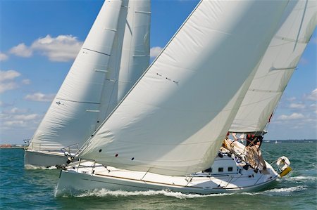 sail race - Two beautiful white yachts racing close to each other on a bright sunny day Stock Photo - Budget Royalty-Free & Subscription, Code: 400-05102820