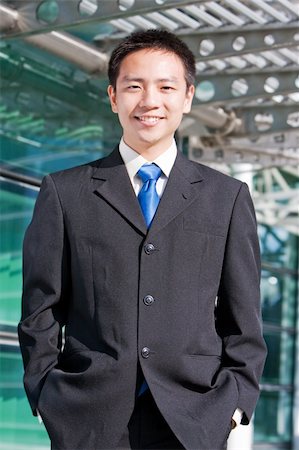 simsearch:400-04130666,k - Good looking asian business man standing with formal suit. Foto de stock - Royalty-Free Super Valor e Assinatura, Número: 400-05102886