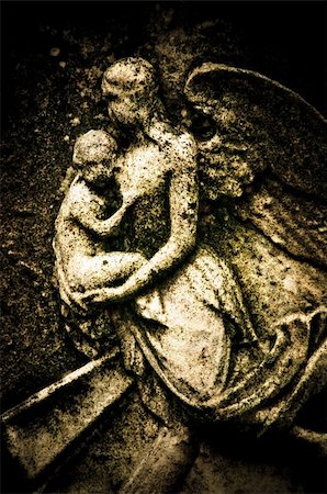 roman gods - A stone carving of an angel mother and child Foto de stock - Super Valor sin royalties y Suscripción, Código: 400-05103058