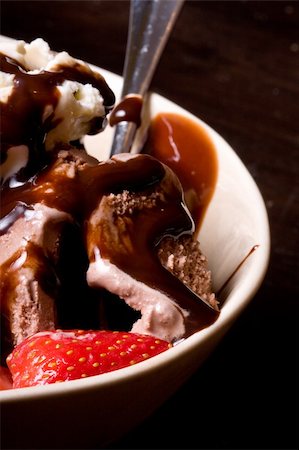 ice cream covered in chocolate shot close up dark background Stock Photo - Budget Royalty-Free & Subscription, Code: 400-05103113