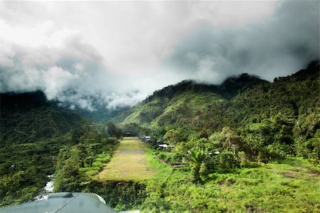 plane rain - A runway in a mountain village - approachnig with a small aircraft Stock Photo - Budget Royalty-Free & Subscription, Code: 400-05103626