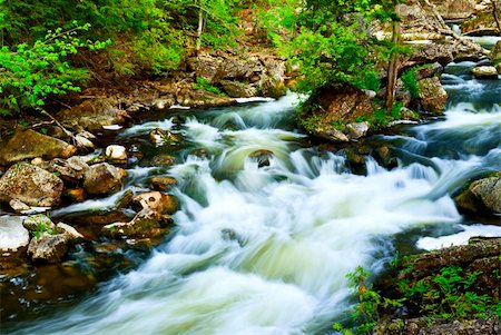 simsearch:400-04452321,k - Water rushing among rocks in river rapids in Ontario Canada Fotografie stock - Microstock e Abbonamento, Codice: 400-05114739