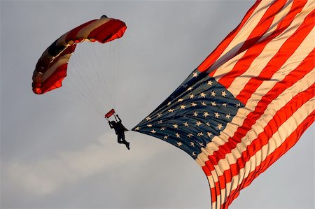 A skydiver floats to earth with the American flag Stock Photo - Budget Royalty-Free & Subscription, Code: 400-05114816