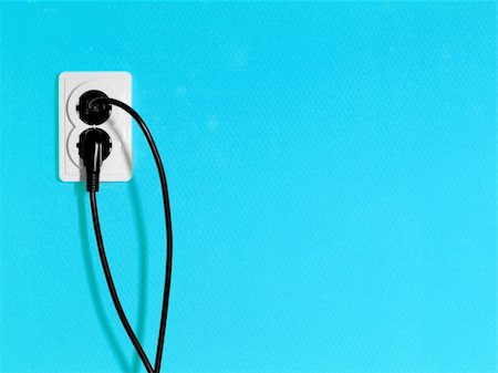 simsearch:400-04836001,k - Electric sockets on blue wall with plugs in them Stock Photo - Budget Royalty-Free & Subscription, Code: 400-05115025