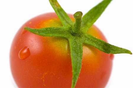 simsearch:400-03914983,k - A single cherry tomato isolated on white Photographie de stock - Aubaine LD & Abonnement, Code: 400-05115190