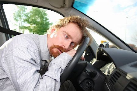 tired driver sleeps in a car Stock Photo - Budget Royalty-Free & Subscription, Code: 400-05115605