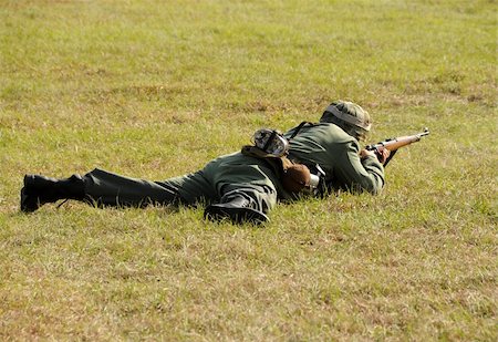 World War II era soldier lying on the ground Stock Photo - Budget Royalty-Free & Subscription, Code: 400-05115631