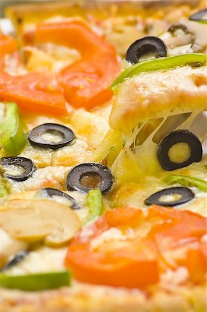 pizza with black background - homemade pizza with fresh tomato olive mushroom cheese isolated Stock Photo - Budget Royalty-Free & Subscription, Code: 400-05115896