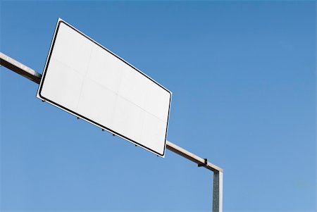 route street signs - Blank street sign on the blue sky, useful to create your own design Stock Photo - Budget Royalty-Free & Subscription, Code: 400-05115900