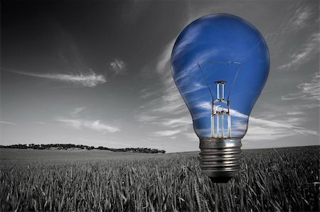 black and white landcape with blue light bulb in the sky - environmental concept Stockbilder - Microstock & Abonnement, Bildnummer: 400-05115996