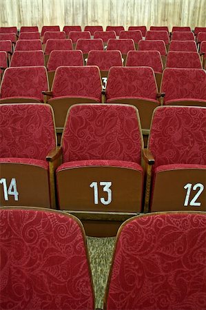 simsearch:700-02593843,k - purple empty cinema seats with white numbers, Fotografie stock - Microstock e Abbonamento, Codice: 400-05116033
