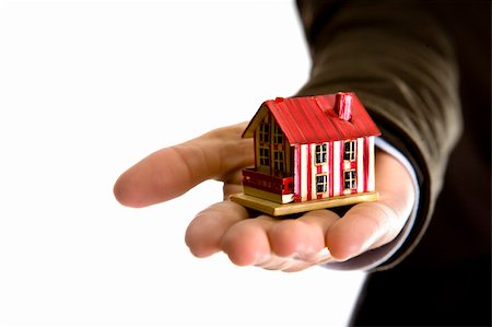 roof and hands - woman hand holding small house - real state concept Stock Photo - Budget Royalty-Free & Subscription, Code: 400-05117006