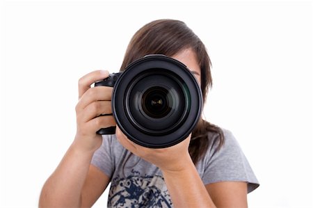 young female photographer with digital slr isolated on white background Stockbilder - Microstock & Abonnement, Bildnummer: 400-05117029