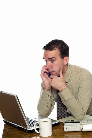 simsearch:400-04486166,k - A young businessman sitting at his desk and talking on his cell phone, isolated against a white background Stockbilder - Microstock & Abonnement, Bildnummer: 400-05117124