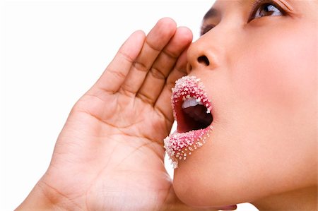 close up face of Asian woman shouting with her lips covered with sugar (PS: focus on the lips, the eye partially sharp) Foto de stock - Super Valor sin royalties y Suscripción, Código: 400-05117239