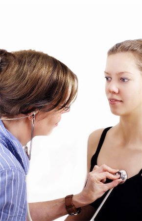 Young woman is getting medical check up with stethoscope Fotografie stock - Microstock e Abbonamento, Codice: 400-05117371