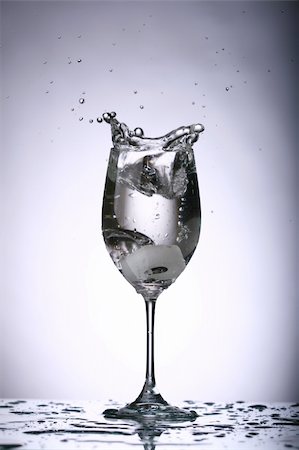 dry ice - alcohol splash on the gray background close up Stock Photo - Budget Royalty-Free & Subscription, Code: 400-05117431