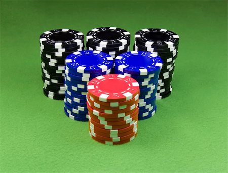 Casino chips over green poker table Stock Photo - Budget Royalty-Free & Subscription, Code: 400-05117957