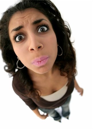 sad indian woman images - A teenage girl with a funny expression. The picture was taken with fisheye lens Stock Photo - Budget Royalty-Free & Subscription, Code: 400-05118668