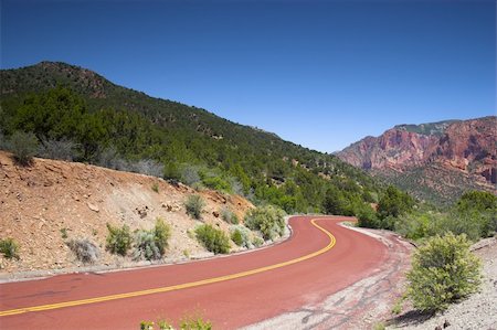 simsearch:400-08187897,k - Red road to the mountains of the Zion National park Stock Photo - Budget Royalty-Free & Subscription, Code: 400-05119020