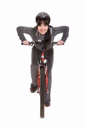 riding a bike funny pic - attractive brunette woman with bike. over white background Stock Photo - Budget Royalty-Free & Subscription, Code: 400-05119914