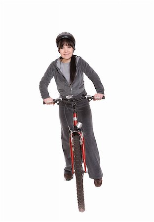 riding a bike funny pic - attractive brunette woman with bike. over white background Stock Photo - Budget Royalty-Free & Subscription, Code: 400-05119913