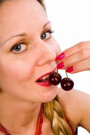 Two cherries near opened  mouth of blonde woman Stock Photo - Budget Royalty-Free & Subscription, Code: 400-05110560
